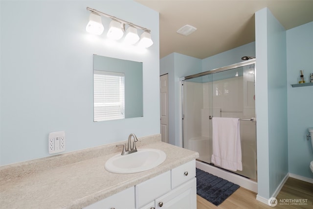 2760 SW Jabirin Way, Port Orchard, WA 98367 - full bath featuring a shower stall, vanity, toilet, and wood finished floors