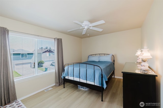 2760 SW Jabirin Way, Port Orchard, WA 98367 - bedroom featuring light wood finished floors, baseboards, and a ceiling fan