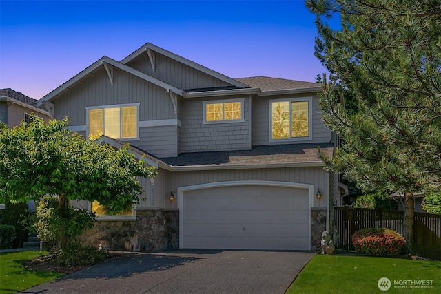 27332 SE 10th Ct, Sammamish, WA 98075 - craftsman house featuring stone siding, a shingled roof, and an attached garage