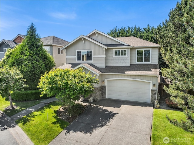 27332 SE 10th Ct, Sammamish, WA 98075 - view of front facade featuring a shingled roof, stone siding, a garage, driveway, and a front lawn