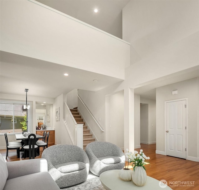 27332 SE 10th Ct, Sammamish, WA 98075 - living room with stairs, wood finished floors, baseboards, and recessed lighting