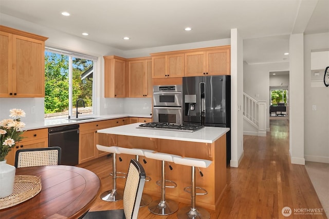 27332 SE 10th Ct, Sammamish, WA 98075 - kitchen with stainless steel appliances, a sink, light wood-type flooring, healthy amount of natural light, and recessed lighting