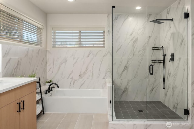 27332 SE 10th Ct, Sammamish, WA 98075 - full bath with a bath, plenty of natural light, a marble finish shower, vanity, and recessed lighting