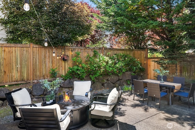 27332 SE 10th Ct, Sammamish, WA 98075 - fenced backyard with a patio area, an outdoor fire pit, and outdoor dining space