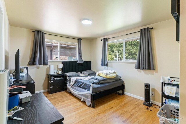 7919 37th Ave S, Seattle, WA 98118 - bedroom featuring wood finished floors and baseboards