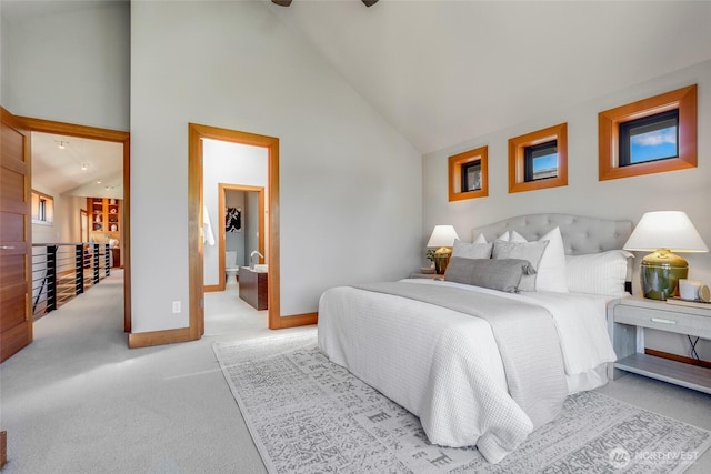 2334 N 57th St, Seattle, WA 98103 - bedroom featuring light colored carpet, baseboards, and high vaulted ceiling