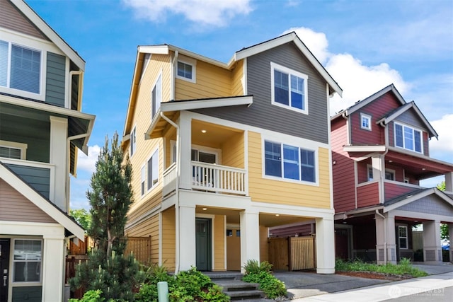 6730 34th Ave SW, Seattle, WA 98126 - view of front of property with a balcony and a carport