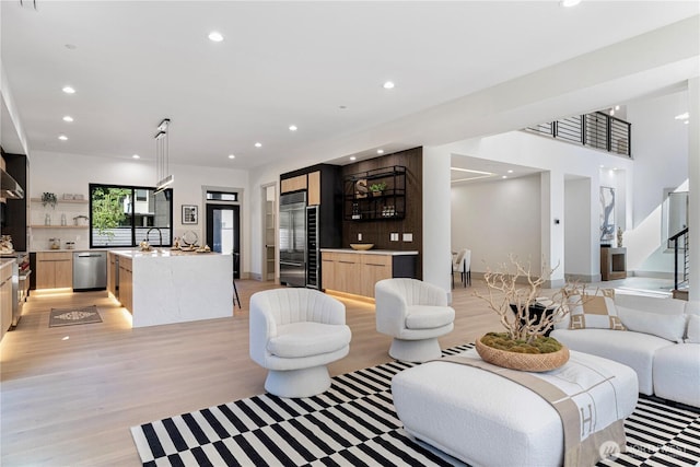 8456 SE 40th St, Mercer Island, WA 98040 - living area with light wood-type flooring, recessed lighting, and stairway