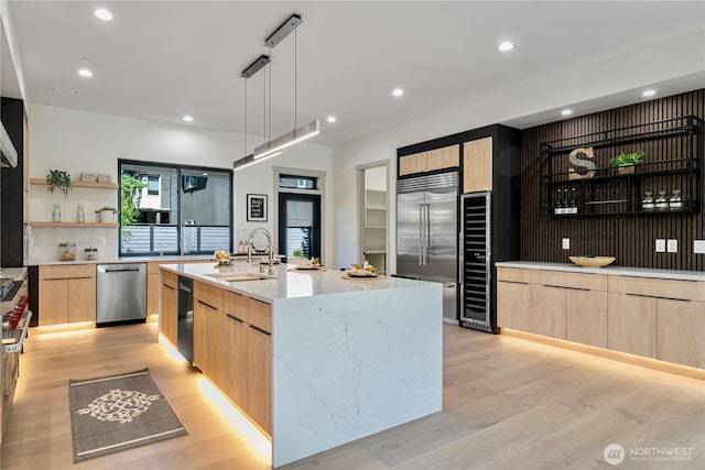 8456 SE 40th St, Mercer Island, WA 98040 - kitchen with modern cabinets, light brown cabinets, a sink, stainless steel appliances, and recessed lighting