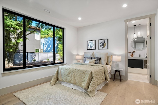 8456 SE 40th St, Mercer Island, WA 98040 - bedroom with light wood finished floors, recessed lighting, and ensuite bath