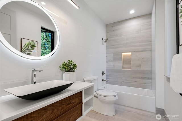 8456 SE 40th St, Mercer Island, WA 98040 - full bathroom with toilet, vanity, shower / bathtub combination, wood finished floors, and recessed lighting