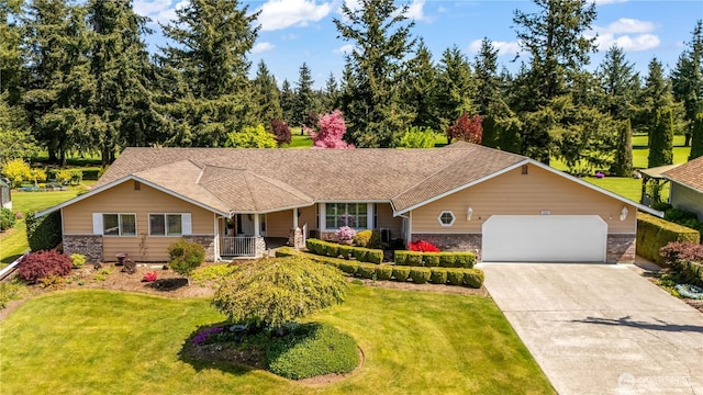 6888 Golf View Dr, Lynden, WA 98264 - single story home with brick siding, a front yard, concrete driveway, an attached garage, and a porch