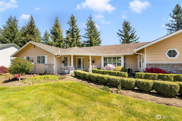 6888 Golf View Dr, Lynden, WA 98264 - ranch-style house with a front lawn, covered porch, and brick siding
