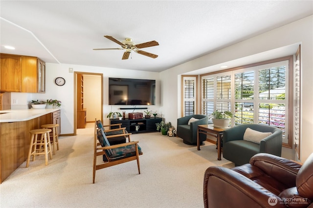 6888 Golf View Dr, Lynden, WA 98264 - living room featuring a ceiling fan, light carpet, and baseboards