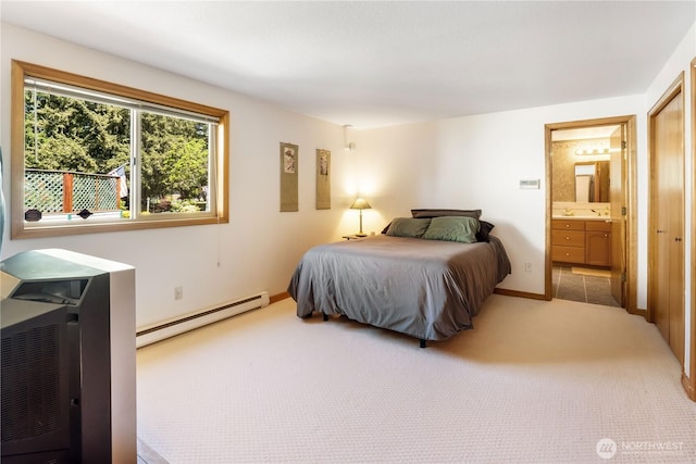 6888 Golf View Dr, Lynden, WA 98264 - carpeted bedroom featuring a baseboard radiator and connected bathroom