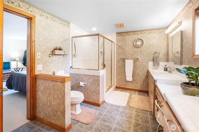 6888 Golf View Dr, Lynden, WA 98264 - bathroom with ensuite bathroom, a shower stall, vanity, toilet, and baseboards