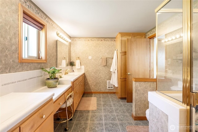 6888 Golf View Dr, Lynden, WA 98264 - bathroom with double vanity, tile patterned flooring, and wallpapered walls