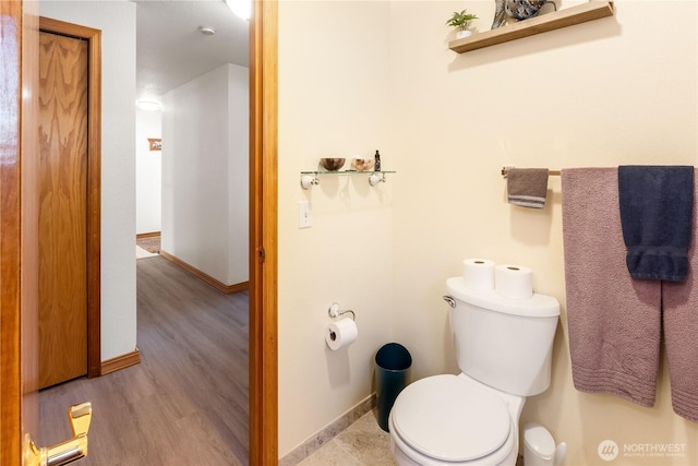 6888 Golf View Dr, Lynden, WA 98264 - half bathroom with toilet, baseboards, and wood finished floors