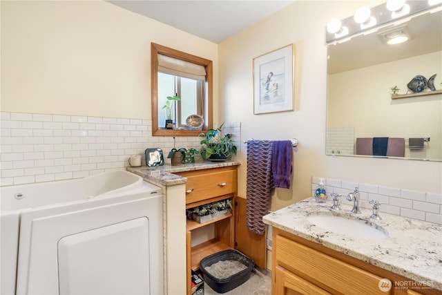 6888 Golf View Dr, Lynden, WA 98264 - full bath with vanity, decorative backsplash, and a garden tub