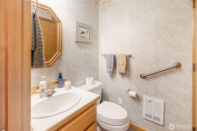 6888 Golf View Dr, Lynden, WA 98264 - bathroom with heating unit, vanity, and toilet