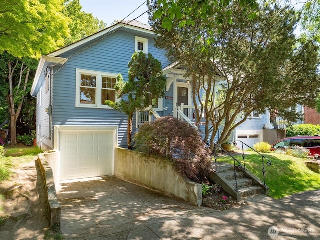 4828 38th Ave NE, Seattle, WA 98105 - view of front facade with concrete driveway, a garage, and stairs