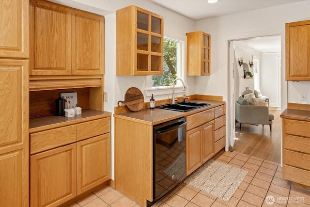 4828 38th Ave NE, Seattle, WA 98105 - kitchen with dishwasher, a sink, glass insert cabinets, light tile patterned floors, and recessed lighting