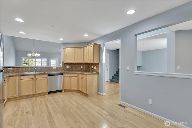5909 Panorama Dr SE Unit 6-103, Auburn, WA 98092 - kitchen featuring stainless steel dishwasher, a sink, light brown cabinets, light wood-style flooring, and decorative backsplash