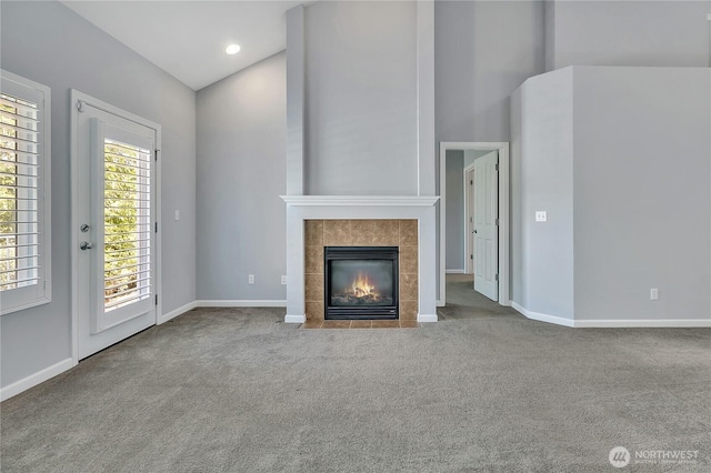 5909 Panorama Dr SE Unit 6-103, Auburn, WA 98092 - unfurnished living room with carpet floors, a tile fireplace, and baseboards