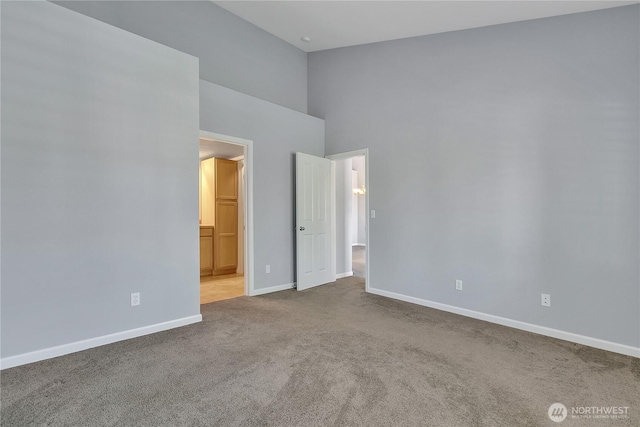 5909 Panorama Dr SE Unit 6-103, Auburn, WA 98092 - unfurnished bedroom with carpet, baseboards, a towering ceiling, and ensuite bath