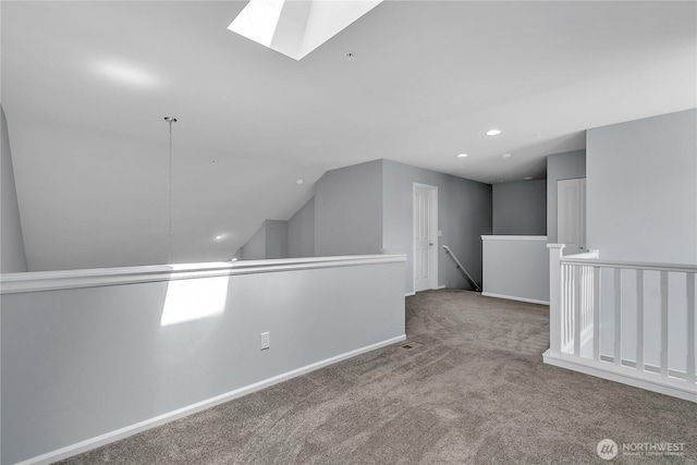 5909 Panorama Dr SE Unit 6-103, Auburn, WA 98092 - carpeted empty room with a skylight, vaulted ceiling, recessed lighting, and baseboards