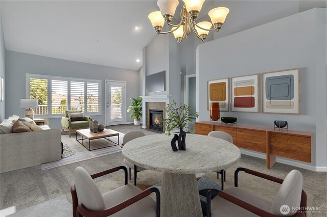 5909 Panorama Dr SE Unit 6-103, Auburn, WA 98092 - dining space featuring high vaulted ceiling, carpet, a chandelier, a fireplace, and baseboards
