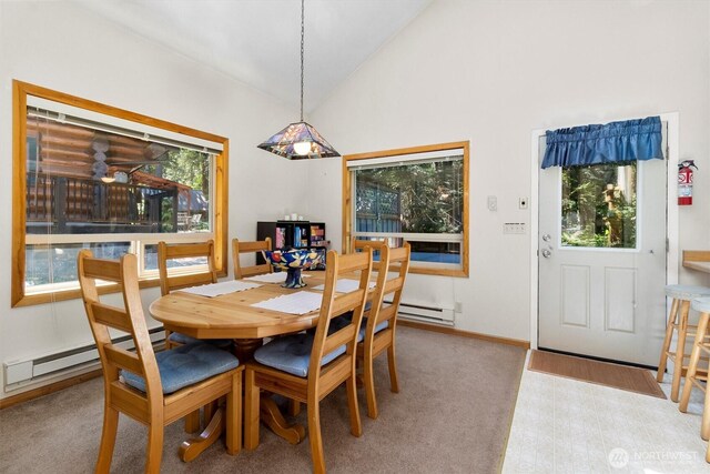 7101 Rainier Way, Glacier, WA 98244 - dining space featuring a baseboard heating unit, high vaulted ceiling, and baseboards