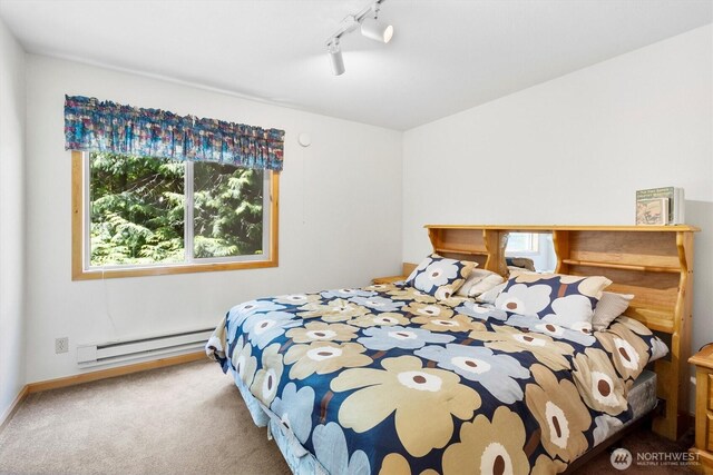 7101 Rainier Way, Glacier, WA 98244 - carpeted bedroom featuring a baseboard radiator, track lighting, and baseboards