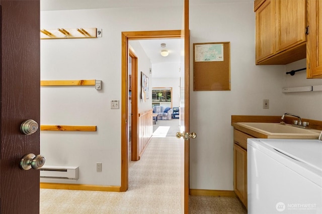 7101 Rainier Way, Glacier, WA 98244 - washroom featuring washer / clothes dryer, a baseboard radiator, cabinet space, and baseboards