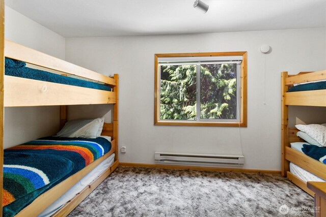 7101 Rainier Way, Glacier, WA 98244 - carpeted bedroom featuring baseboard heating and baseboards