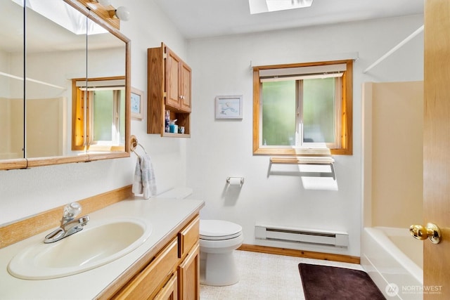 7101 Rainier Way, Glacier, WA 98244 - full bath with a baseboard heating unit, vanity, toilet, tub / shower combination, and healthy amount of natural light