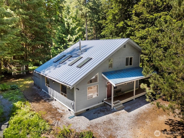 7101 Rainier Way, Glacier, WA 98244 - view of front of house with metal roof, crawl space, a porch, and a wooded view