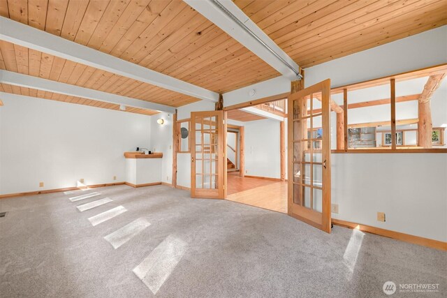 3542 Constitution Rd, Lummi Island, WA 98262 - spare room featuring carpet floors, french doors, baseboards, and wood ceiling with exposed beams