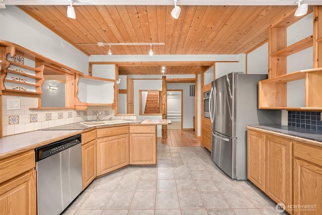 3542 Constitution Rd, Lummi Island, WA 98262 - kitchen featuring open shelves, track lighting, appliances with stainless steel finishes, a sink, and a peninsula