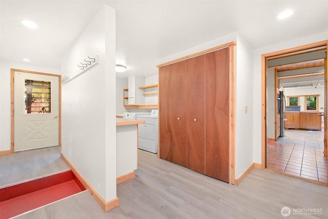 3542 Constitution Rd, Lummi Island, WA 98262 - hallway with washer / clothes dryer, baseboards, light wood finished floors, and recessed lighting