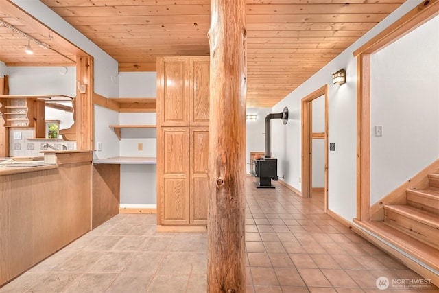 3542 Constitution Rd, Lummi Island, WA 98262 - corridor with wood ceiling, light tile patterned floors, stairs, and rail lighting