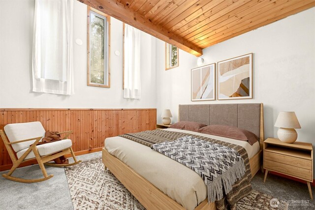 3542 Constitution Rd, Lummi Island, WA 98262 - bedroom with carpet floors, wainscoting, wood ceiling, and wooden walls
