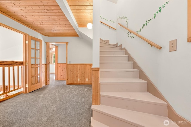 3542 Constitution Rd, Lummi Island, WA 98262 - stairs with wooden ceiling, carpet, a wainscoted wall, and wooden walls