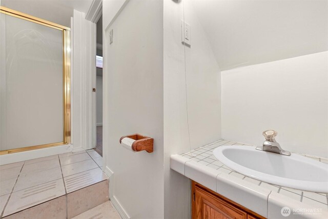 3542 Constitution Rd, Lummi Island, WA 98262 - bathroom featuring a stall shower, vanity, tile patterned flooring, and baseboards