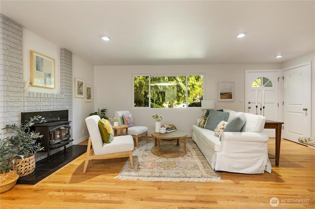 19802 33rd Dr SE, Bothell, WA 98012 - living area featuring a wood stove, wood finished floors, and recessed lighting