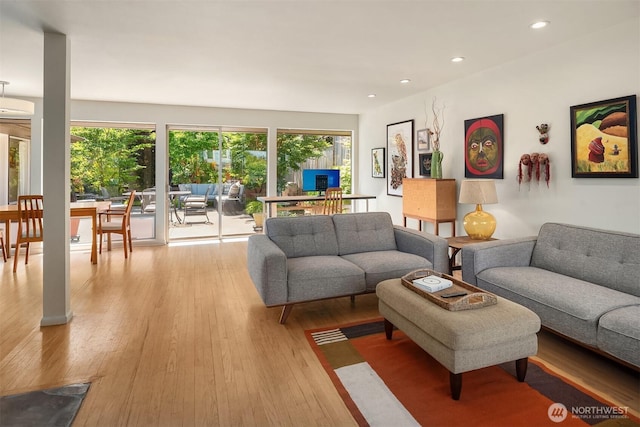2043 N 78th St, Seattle, WA 98103 - living room with plenty of natural light, wood finished floors, and recessed lighting