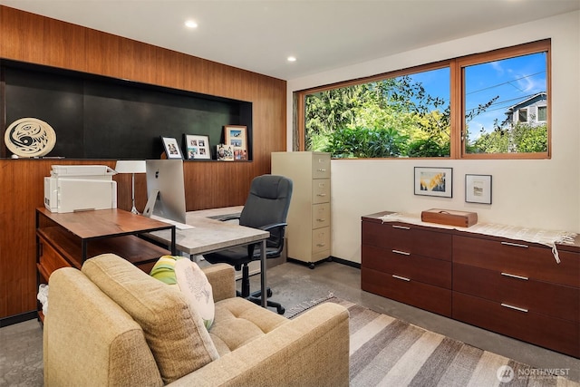 2043 N 78th St, Seattle, WA 98103 - living area with light colored carpet, an office area, recessed lighting, and wooden walls