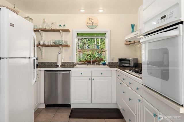 24410 Vashon Hwy SW, Vashon, WA 98070 - kitchen featuring white appliances, a sink, under cabinet range hood, white cabinetry, and light tile patterned flooring