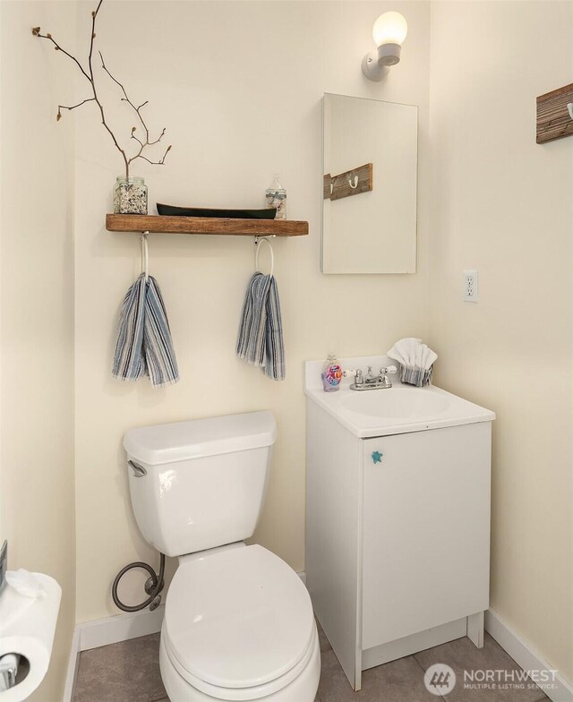 24410 Vashon Hwy SW, Vashon, WA 98070 - bathroom with toilet, baseboards, vanity, and tile patterned floors
