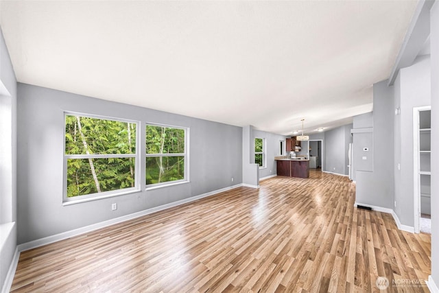 4949 Samish Way Unit 17, Bellingham, WA 98229 - unfurnished living room featuring light wood finished floors and baseboards